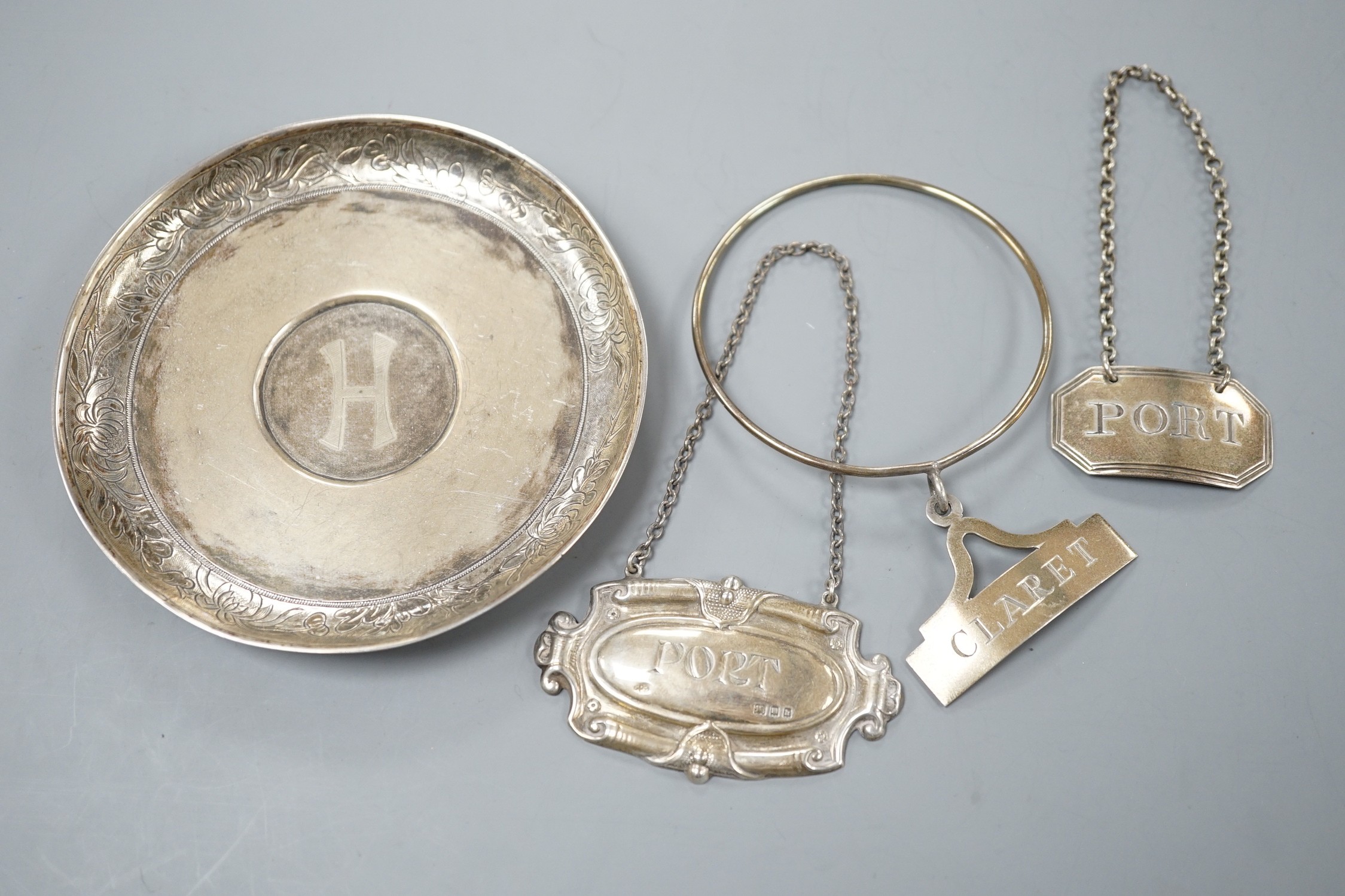 A George III silver 'Port' wine label, Phipps & Robinson, London, 1805, two later silver wine labels and a Chinese dish, signed LH.